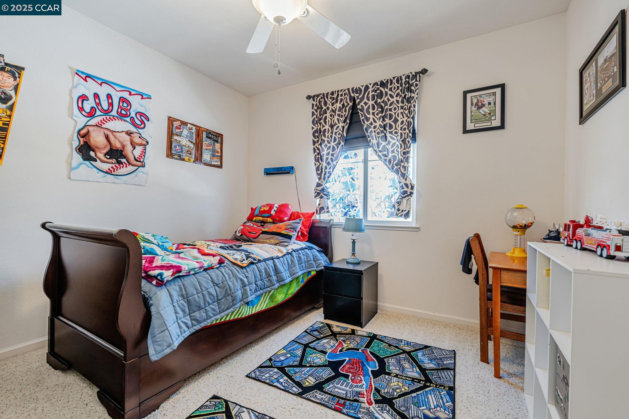 20640 Sarazen Place Patterson, CA 95363 - Photo 18 of 28 a bedroom with a bed and a dresser in it
