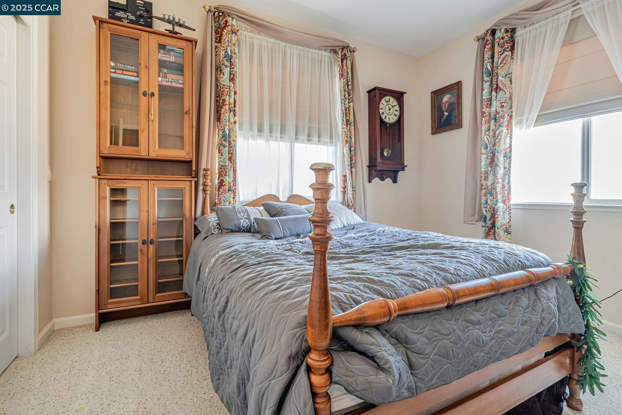 20640 Sarazen Place Patterson, CA 95363 - Photo 20 of 28 a bedroom with a bed and a window