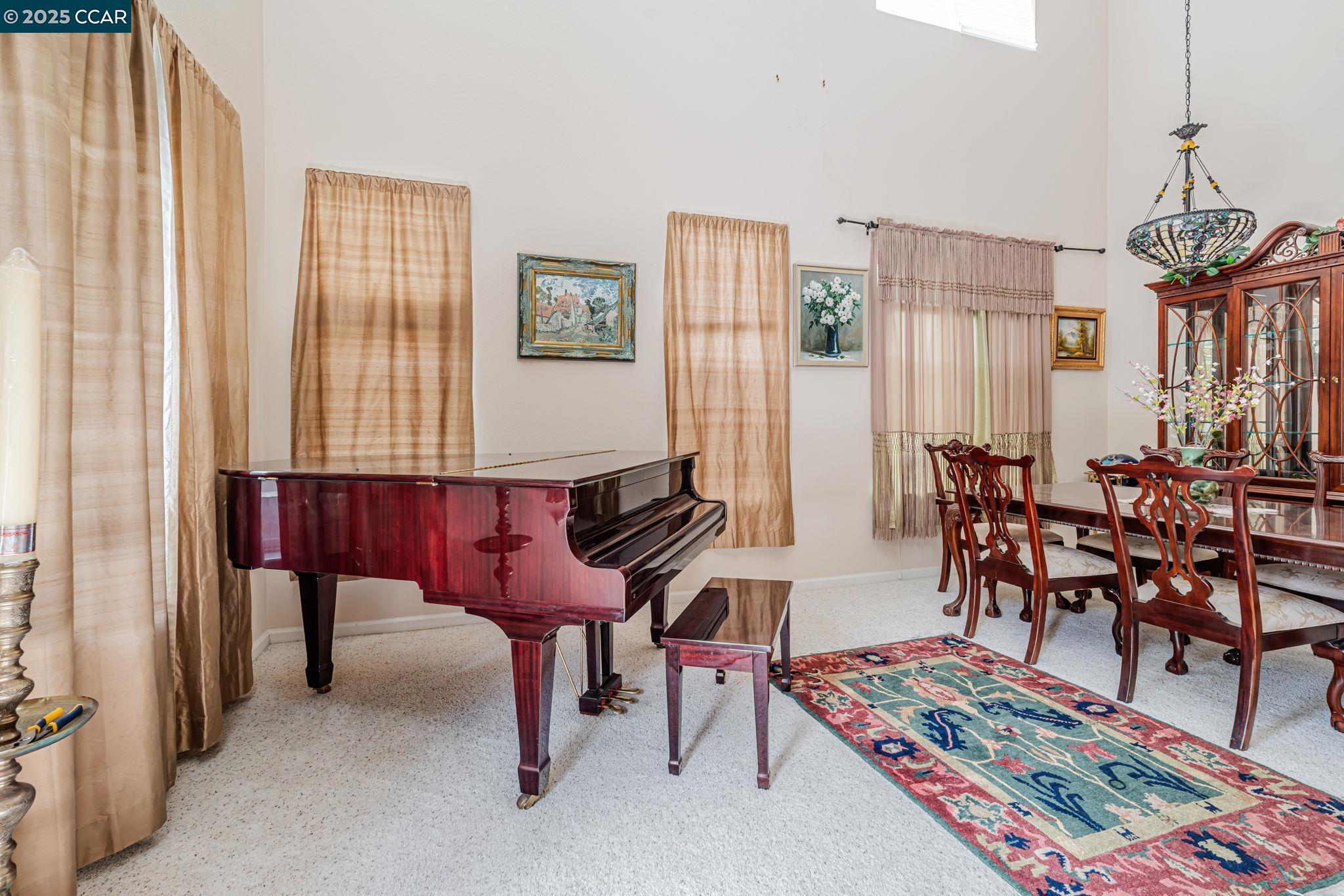 20640 Sarazen Place Patterson, CA 95363 - Photo 4 of 28 a room with furniture a rug and a window