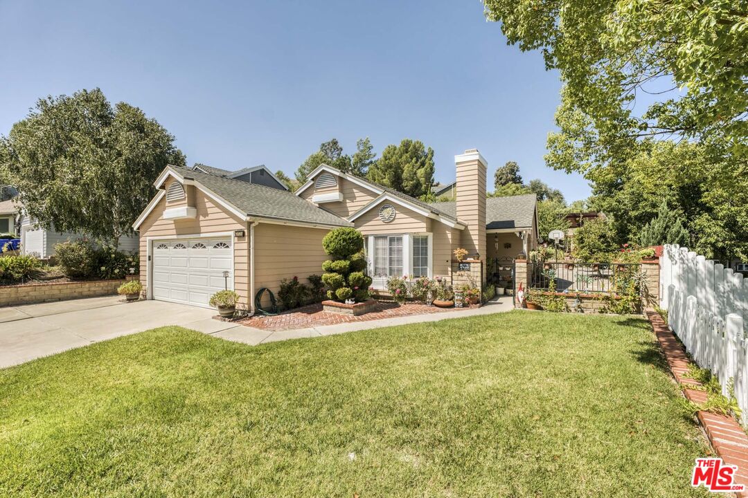 28135 Royal Road Castaic, CA 91384 - Photo 1 of 37 a view of a house with a yard and sitting area