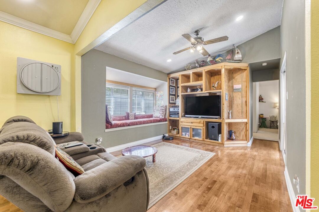 28135 Royal Road Castaic, CA 91384 - Photo 13 of 37 a living room with furniture and a flat screen tv