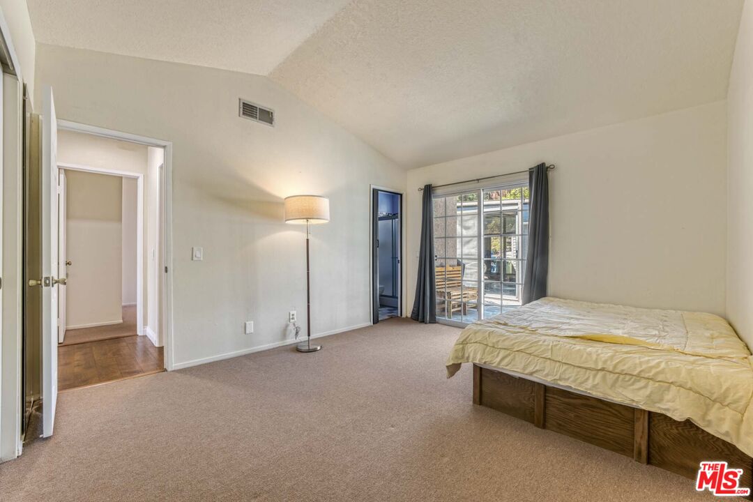 28135 Royal Road Castaic, CA 91384 - Photo 14 of 37 a spacious bedroom with a bed and a window