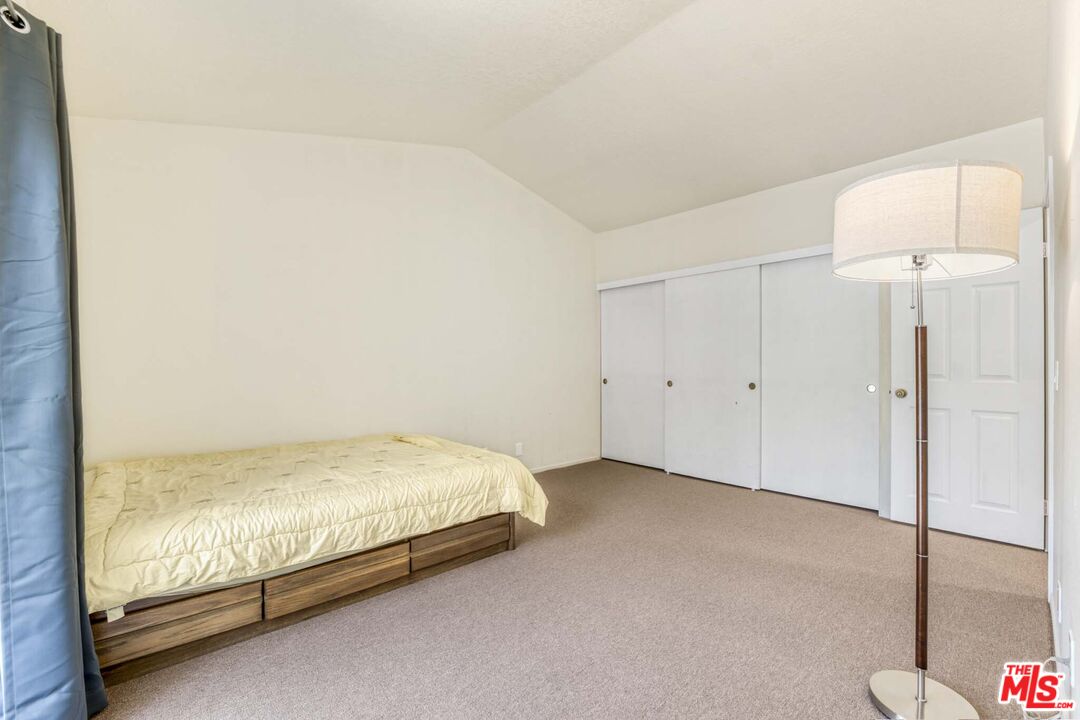 28135 Royal Road Castaic, CA 91384 - Photo 18 of 37 a room with a bed and a night stand