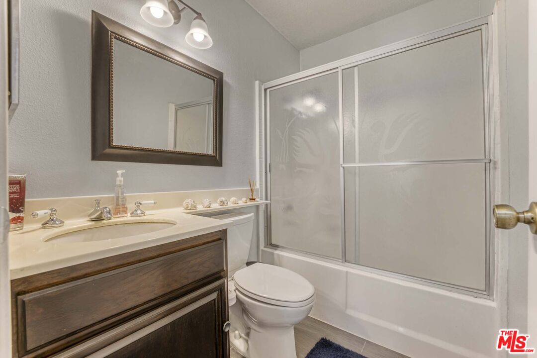 28135 Royal Road Castaic, CA 91384 - Photo 20 of 37 a bathroom with a sink a toilet and shower