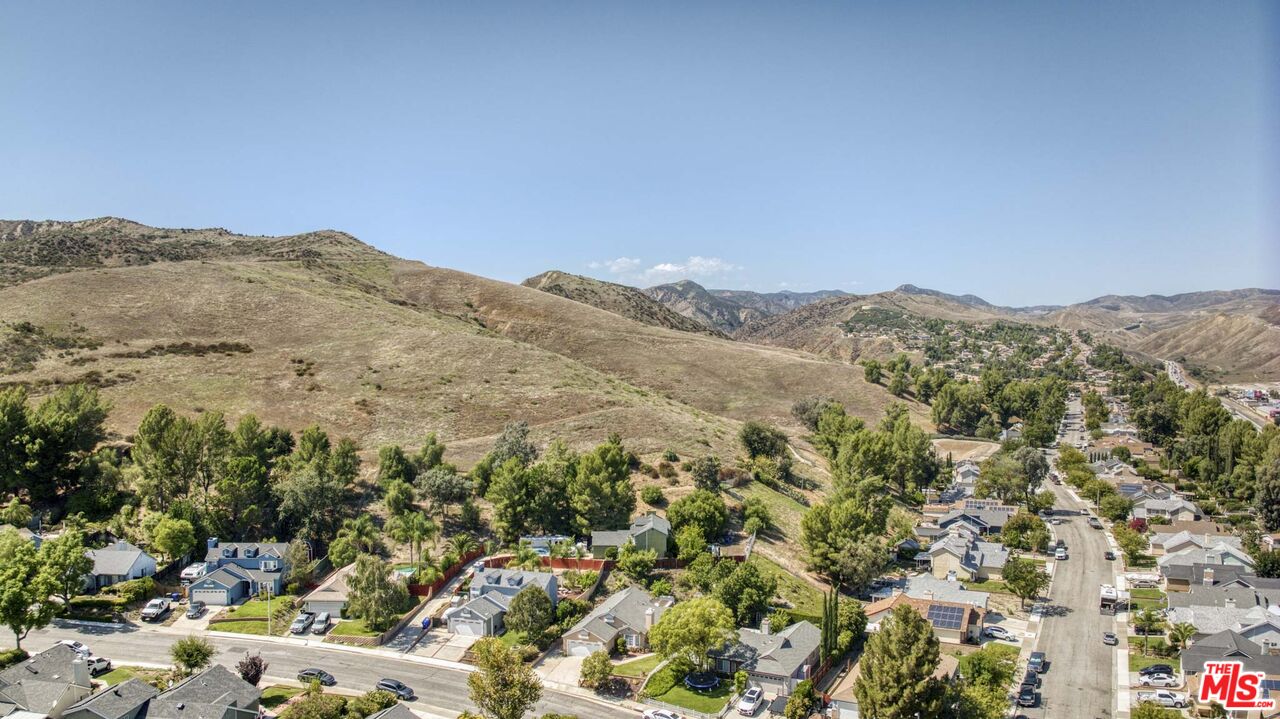 28135 Royal Road Castaic, CA 91384 - Photo 33 of 37 a view of a mountain range in a cloudy sky
