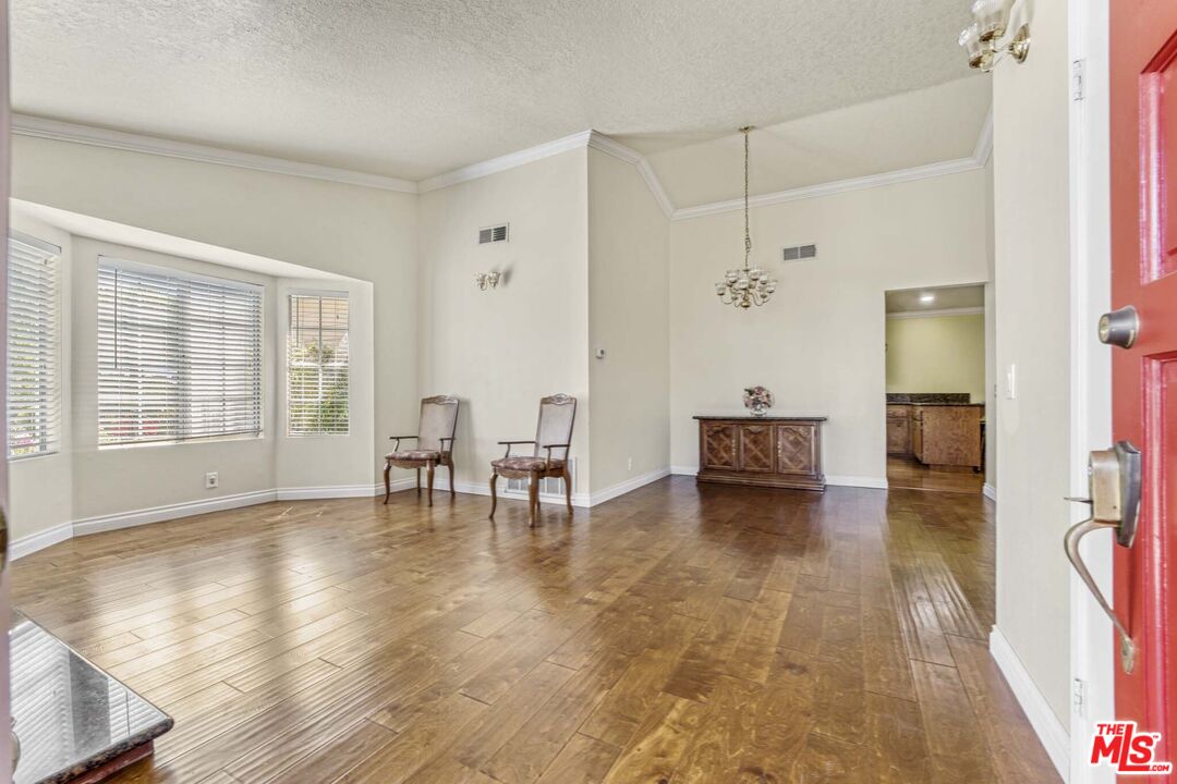 28135 Royal Road Castaic, CA 91384 - Photo 4 of 37 a view of an empty room with glass door and furniture