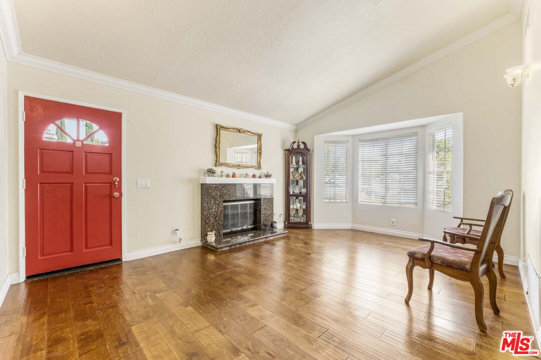 28135 Royal Road Castaic, CA 91384 - Photo 5 of 37 a view of a livingroom with furniture and a fireplace