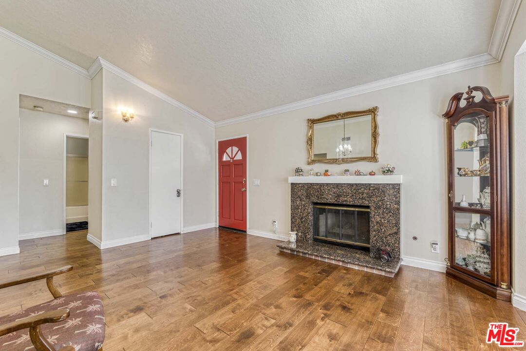 28135 Royal Road Castaic, CA 91384 - Photo 6 of 37 a view of an empty room with furniture and a fireplace