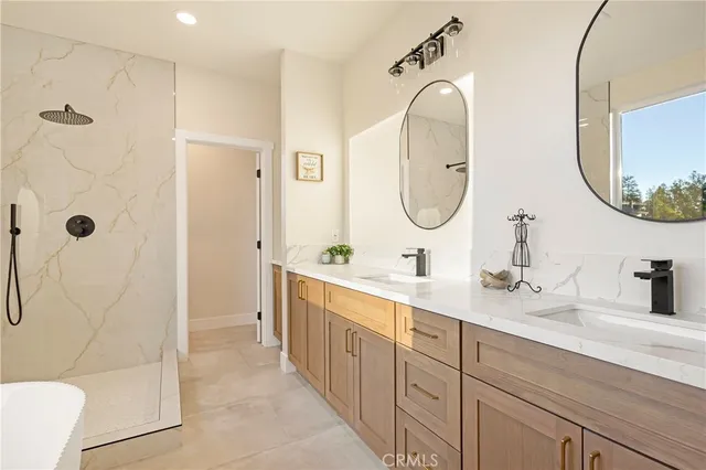 a spacious bathroom with a toilet sink and mirror