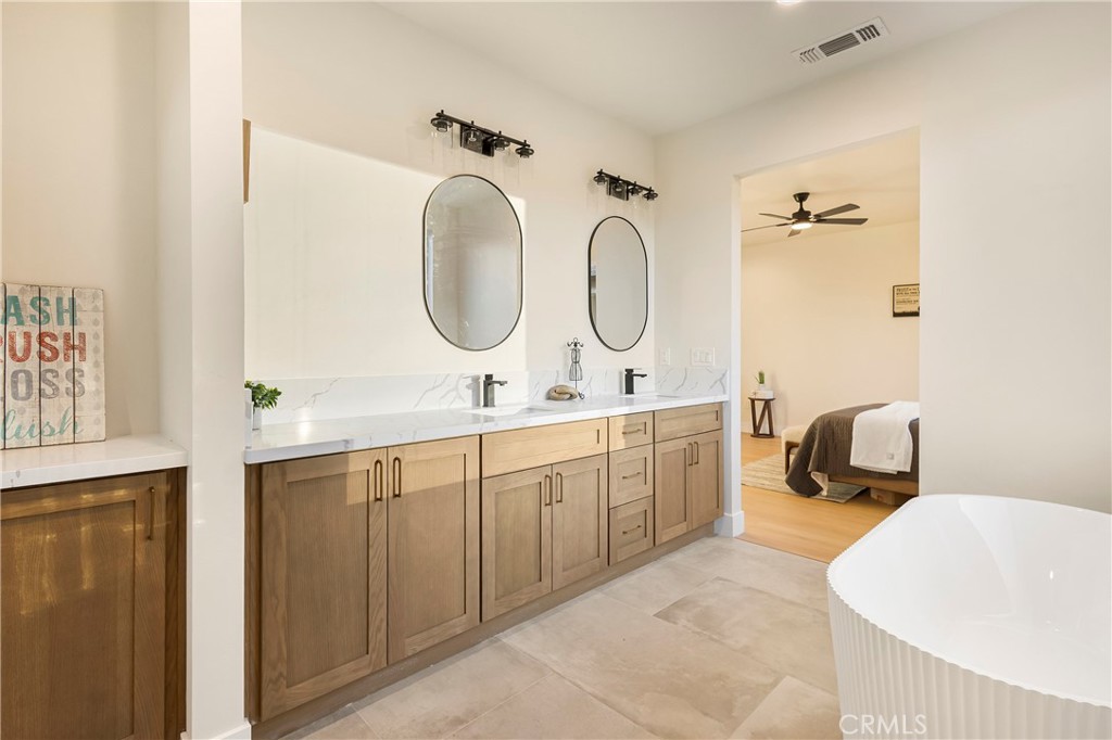 6185 Pentz Road Paradise, CA 95969 - Photo 24 of 53 a spacious bathroom with a double vanity sink mirror and bathtub
