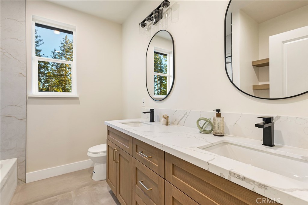 6185 Pentz Road Paradise, CA 95969 - Photo 30 of 53 a bathroom with a sink and a mirror