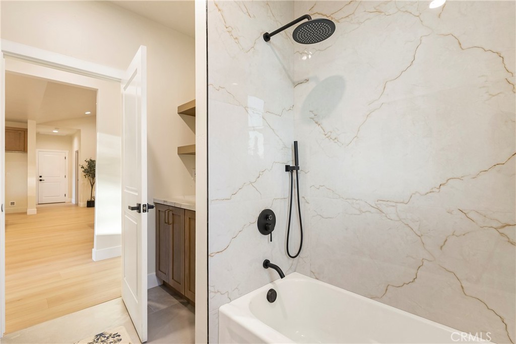 6185 Pentz Road Paradise, CA 95969 - Photo 32 of 53 a bathroom with a tub and a shower