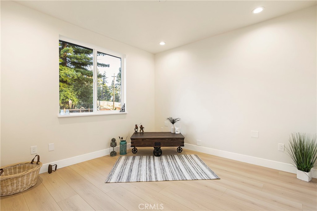 6185 Pentz Road Paradise, CA 95969 - Photo 33 of 53 a living room with a bed and a wooden floor