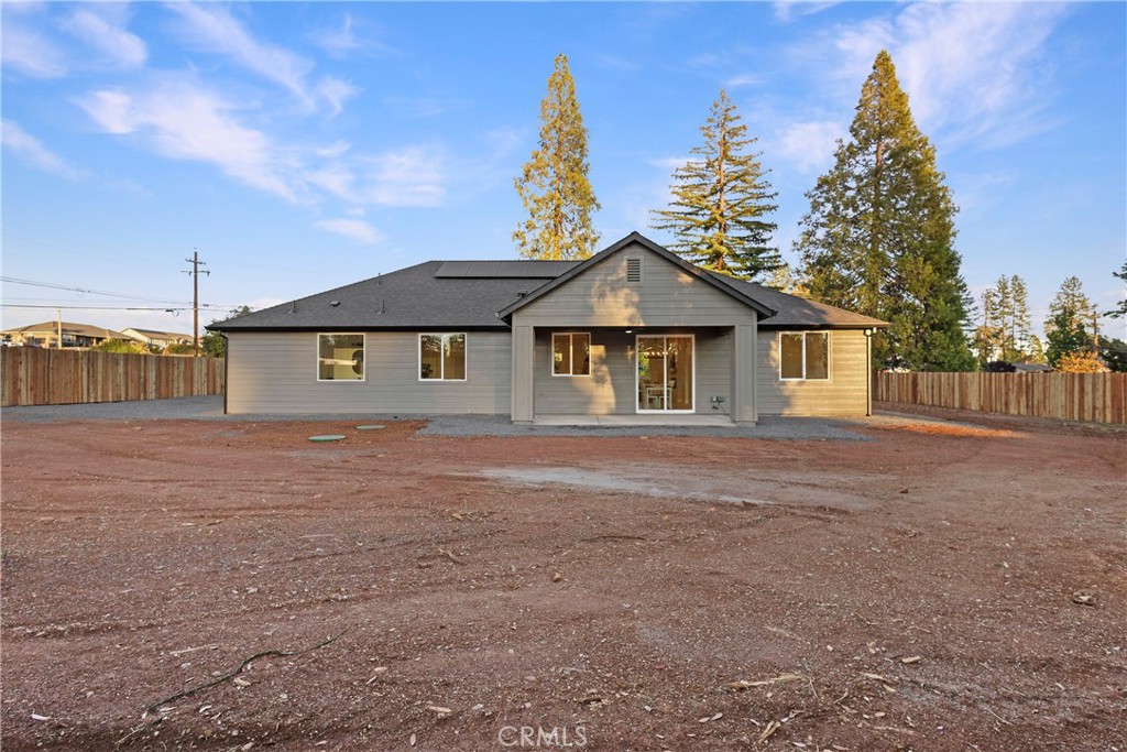 6185 Pentz Road Paradise, CA 95969 - Photo 37 of 53 a house with trees in the background