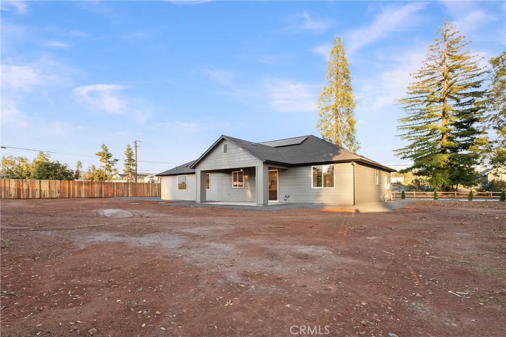 6185 Pentz Road Paradise, CA 95969 - Photo 39 of 53 a view of a large house with a yard and plants