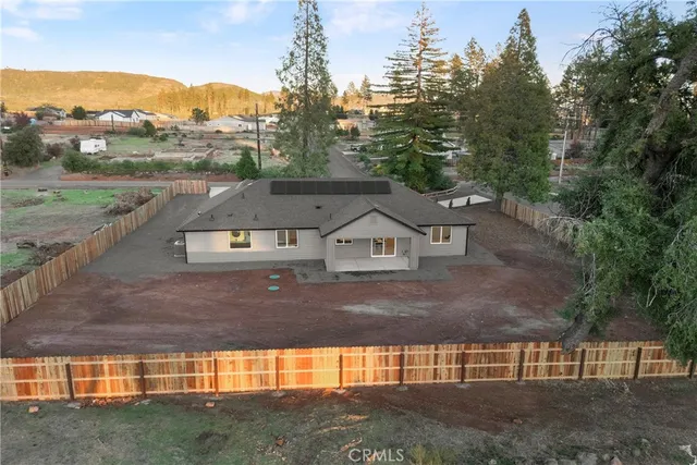 an aerial view of houses with outdoor space