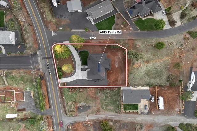 an aerial view of houses with outdoor space