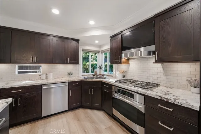 a kitchen with a sink and a large window