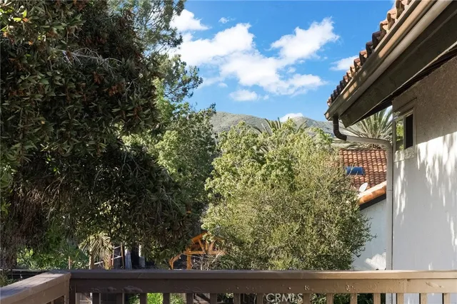 a bedroom with bed and glass door