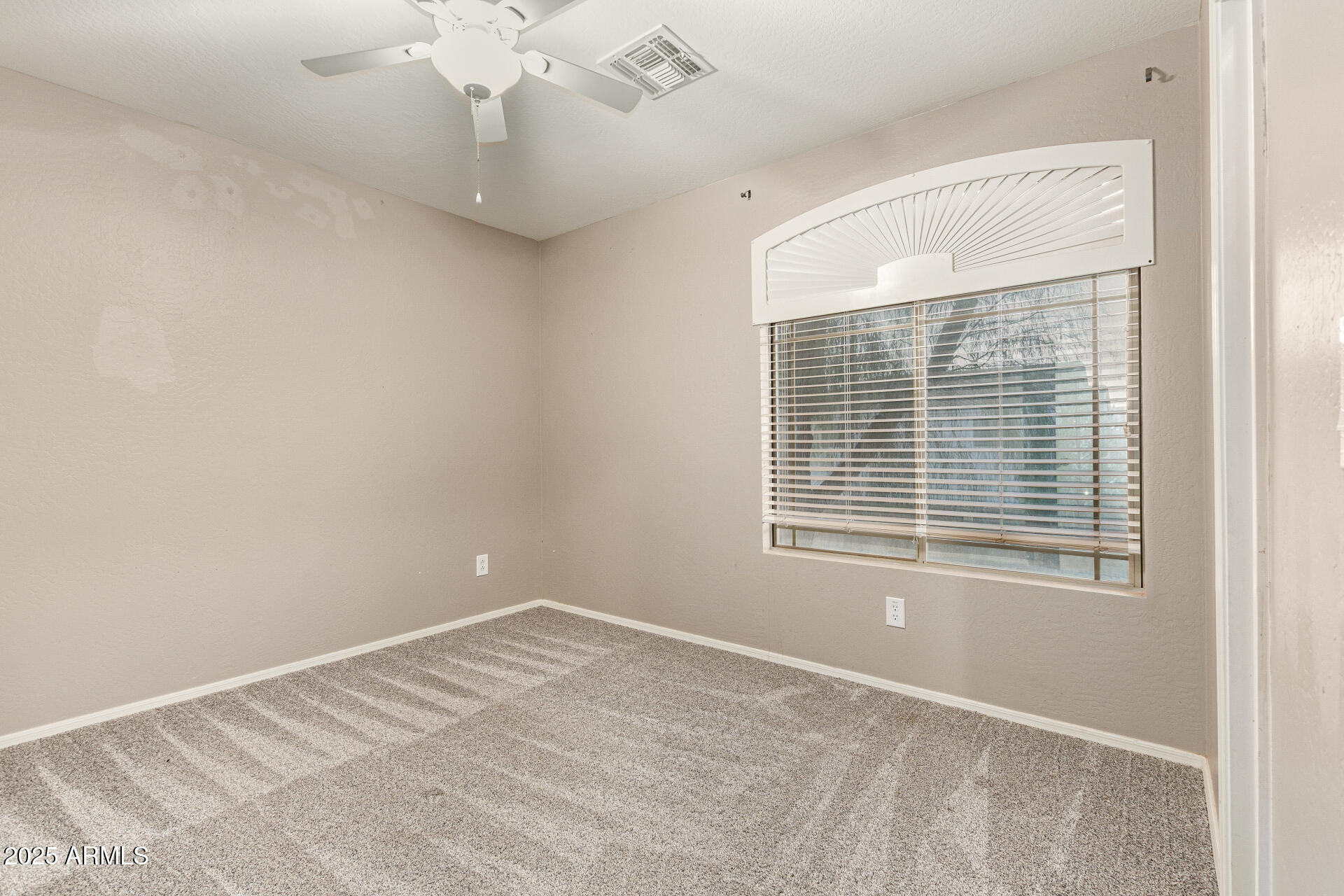 161 South 21st Street Coolidge, AZ 85128 - Photo 14 of 32 a view of an empty room with a window