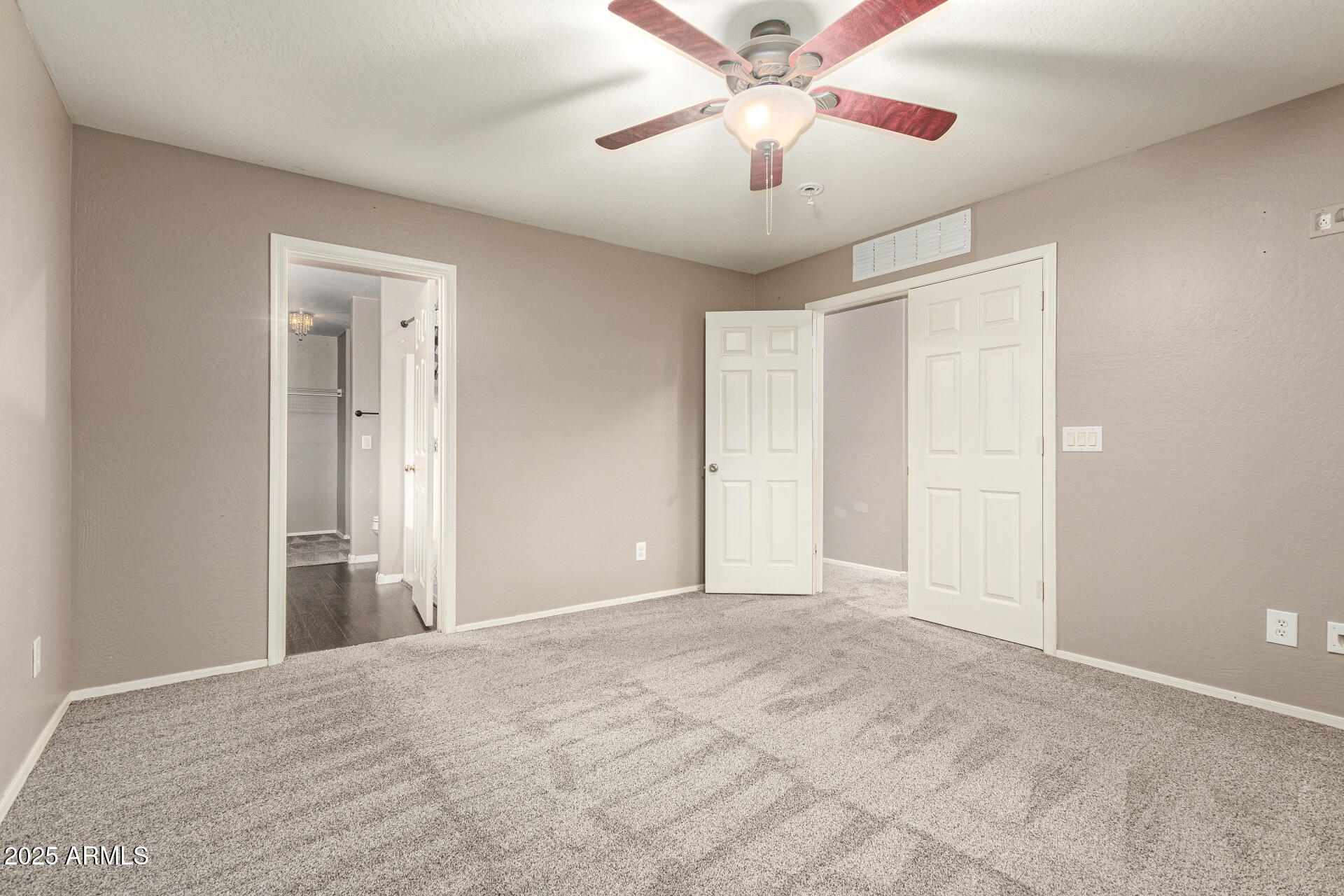 161 South 21st Street Coolidge, AZ 85128 - Photo 16 of 32 a view of an empty room with a chandelier fan