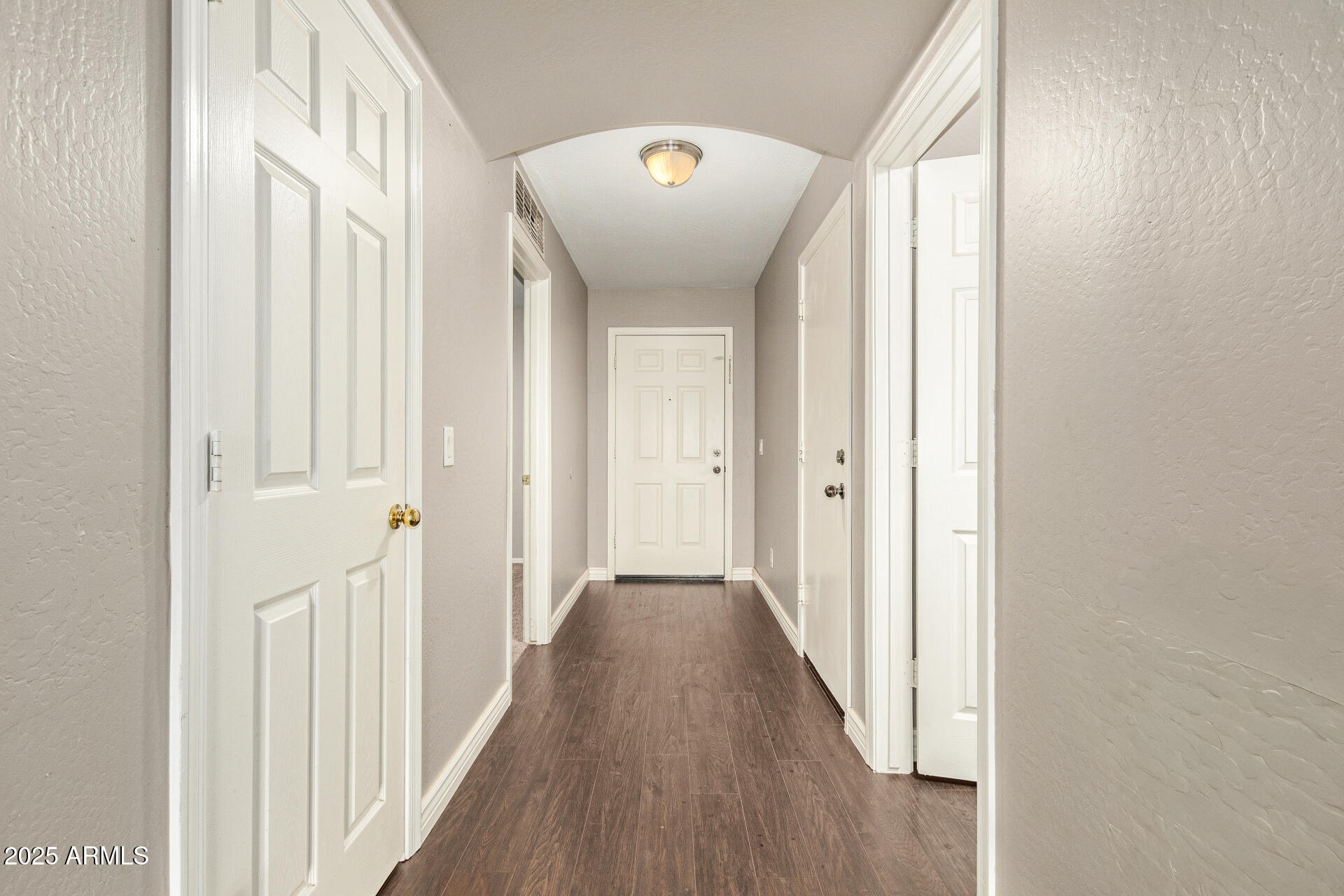 161 South 21st Street Coolidge, AZ 85128 - Photo 2 of 32 a view of a hallway with wooden floor and staircase