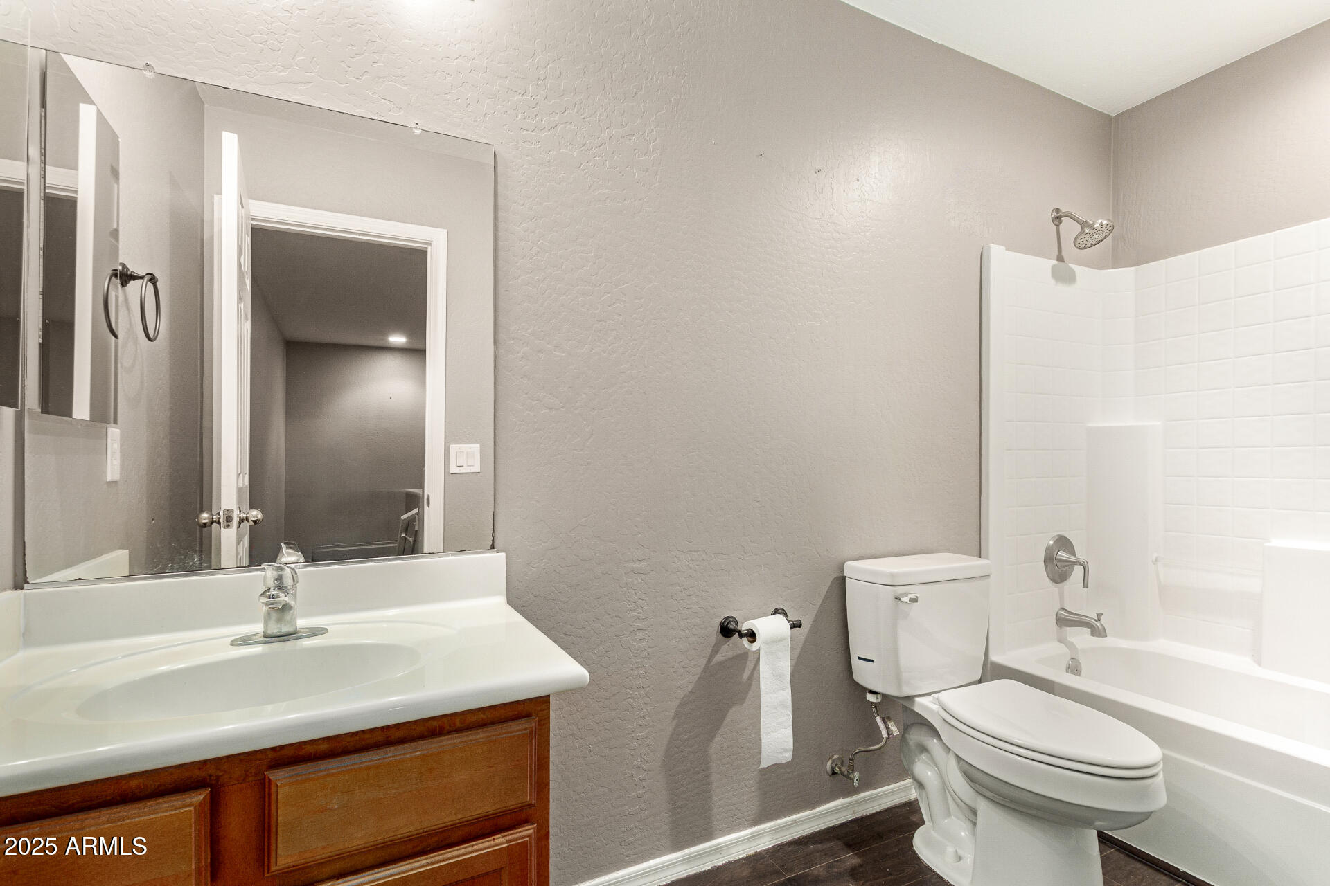 161 South 21st Street Coolidge, AZ 85128 - Photo 22 of 32 a bathroom with a sink toilet vanity and shower