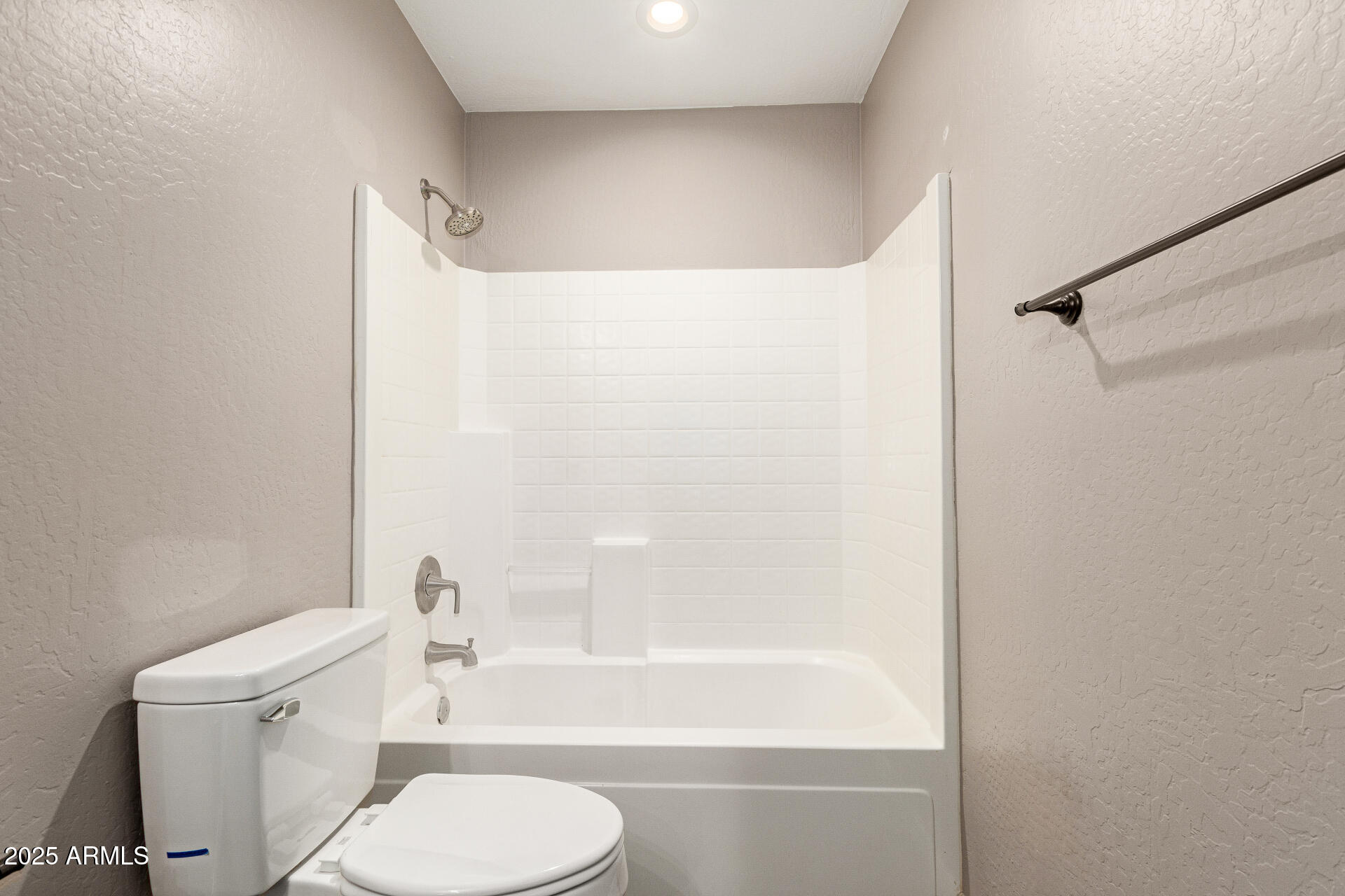 161 South 21st Street Coolidge, AZ 85128 - Photo 23 of 32 a white toilet sitting next to a bath tub