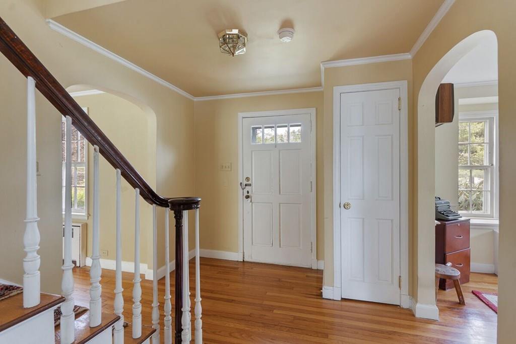 204 Sterling Road Lancaster, MA 01523 - Photo 11 of 41 a view of entryway with wooden floor and stairs