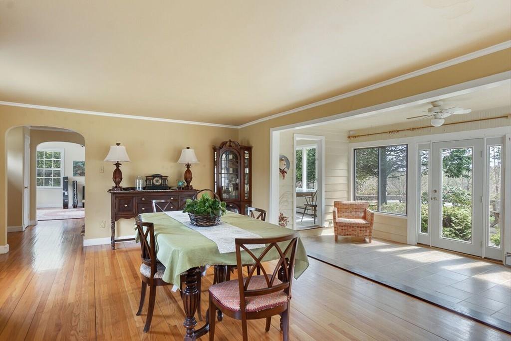 204 Sterling Road Lancaster, MA 01523 - Photo 14 of 41 a view of a dining room with furniture large windows and wooden floor