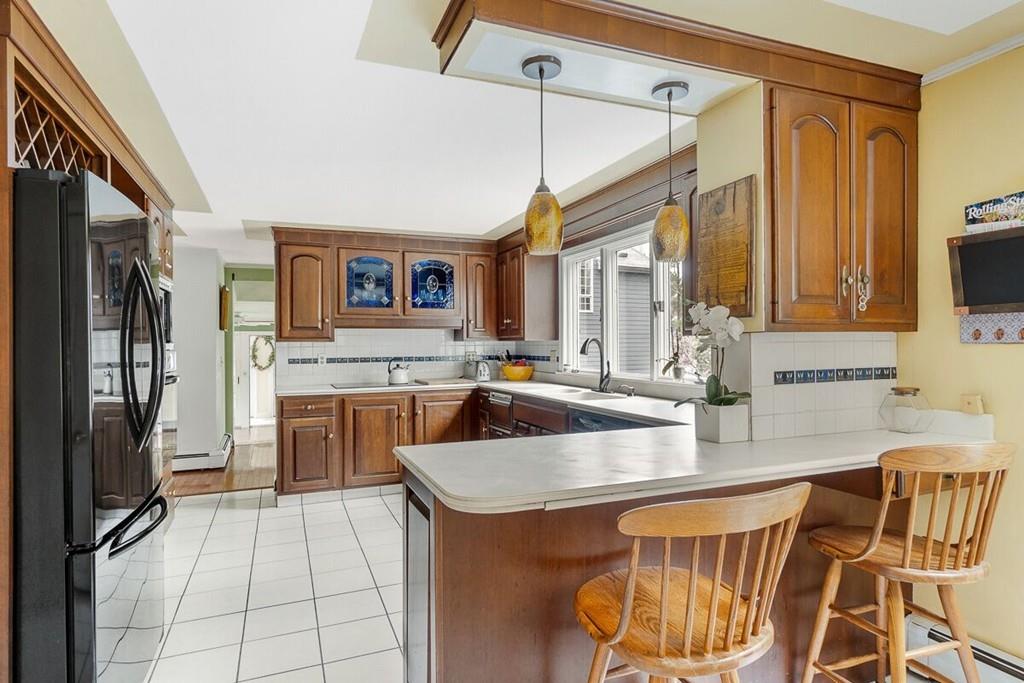 204 Sterling Road Lancaster, MA 01523 - Photo 17 of 41 a kitchen with a sink appliances and cabinets