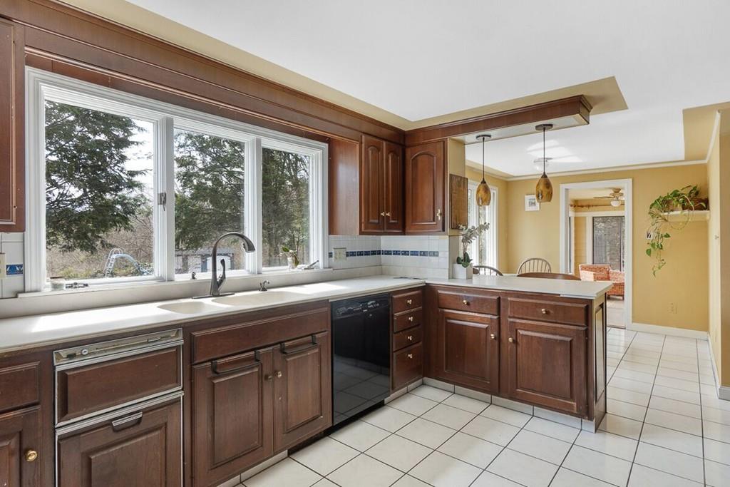 204 Sterling Road Lancaster, MA 01523 - Photo 20 of 41 a kitchen with a sink stove and cabinets