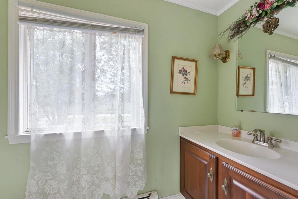 204 Sterling Road Lancaster, MA 01523 - Photo 22 of 41 a bathroom with a sink and a mirror