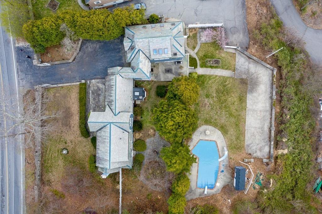 204 Sterling Road Lancaster, MA 01523 - Photo 5 of 41 an aerial view of a house with a yard and trees