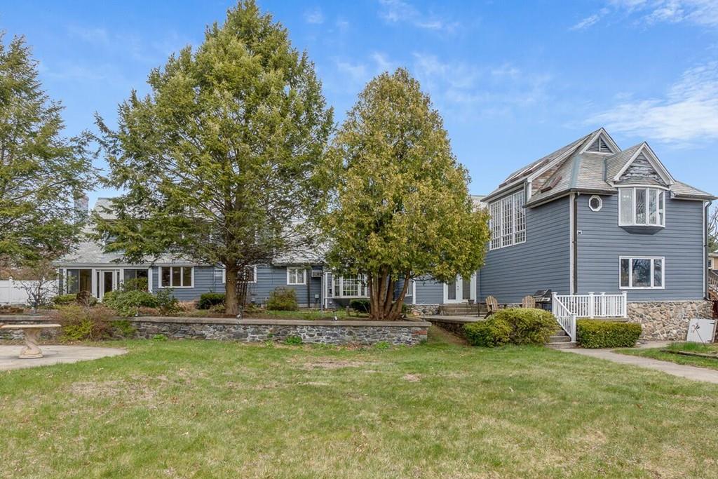 204 Sterling Road Lancaster, MA 01523 - Photo 10 of 41 a front view of a house with a yard