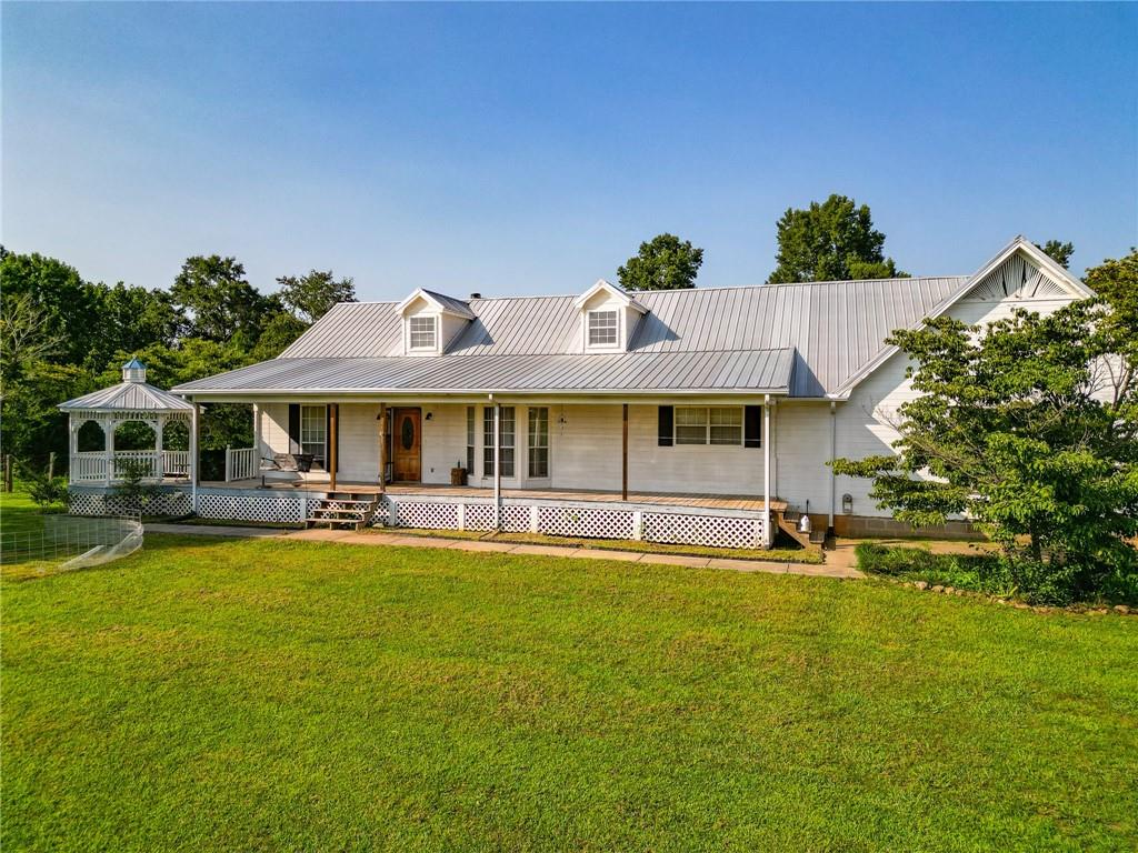 683 Harris Beamer Road Southwest Calhoun, GA 30701 - Photo 1 of 1 a view of an house with swimming pool and chairs