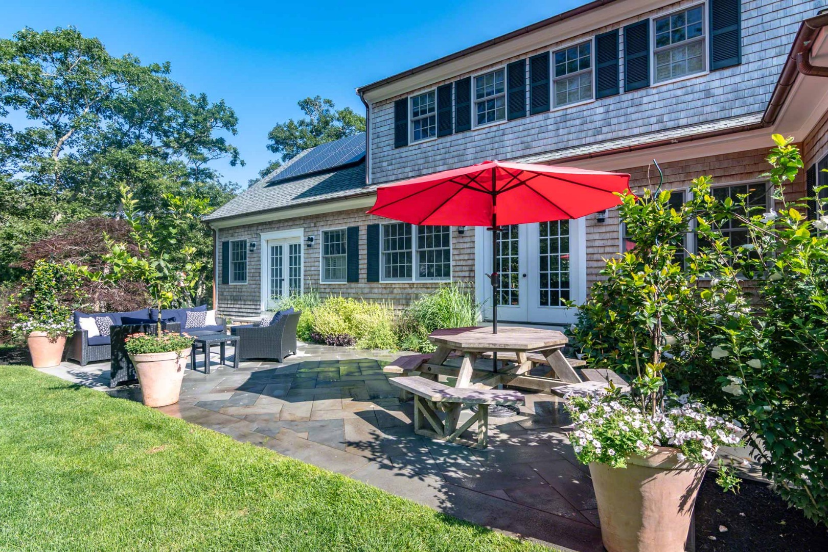 14 North Bog Road Edgartown, MA 02539 - Photo 4 of 46 a view of a house with backyard sitting area and swimming pool