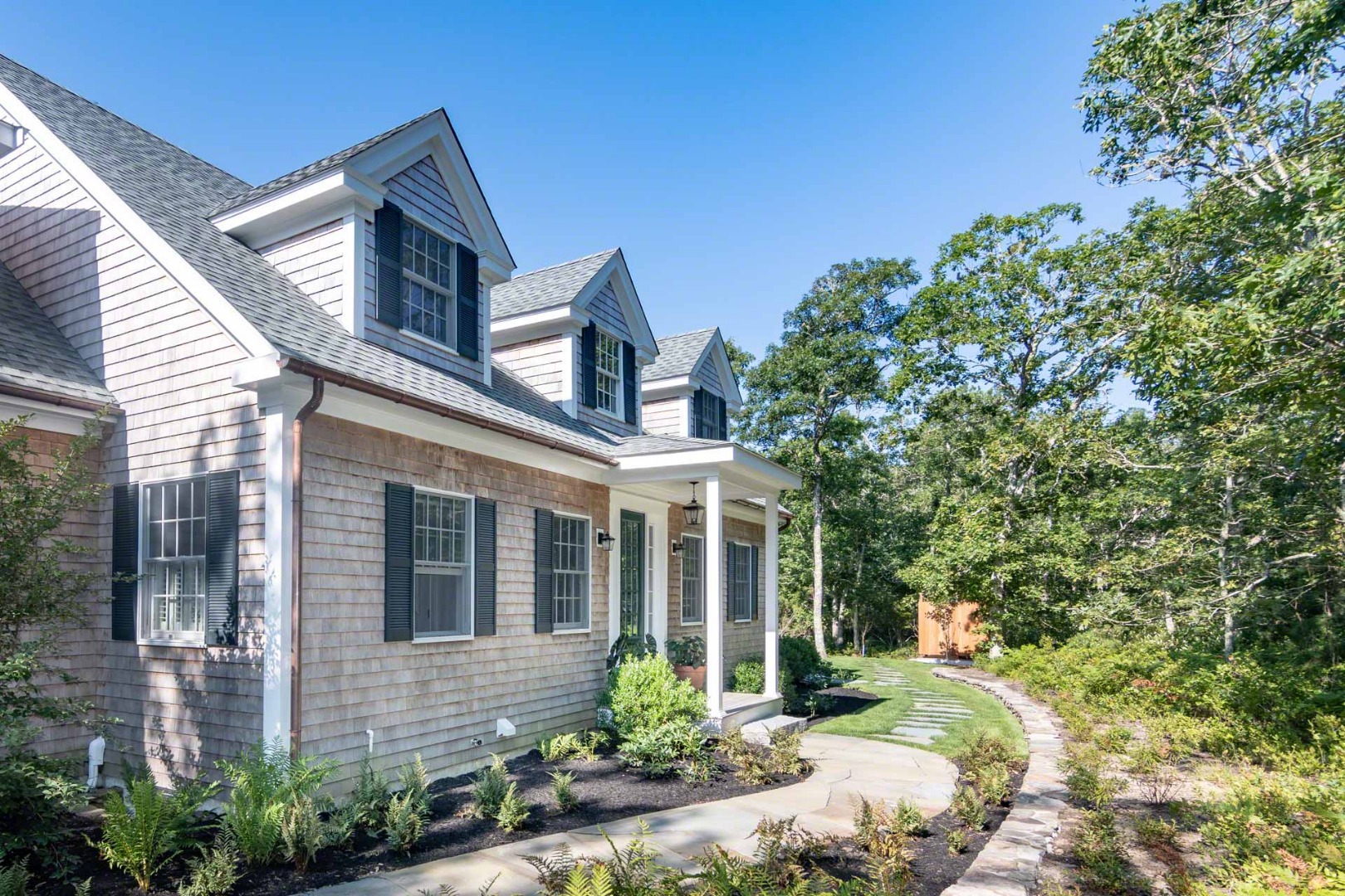 14 North Bog Road Edgartown, MA 02539 - Photo 5 of 46 a front view of a house with a yard and porch