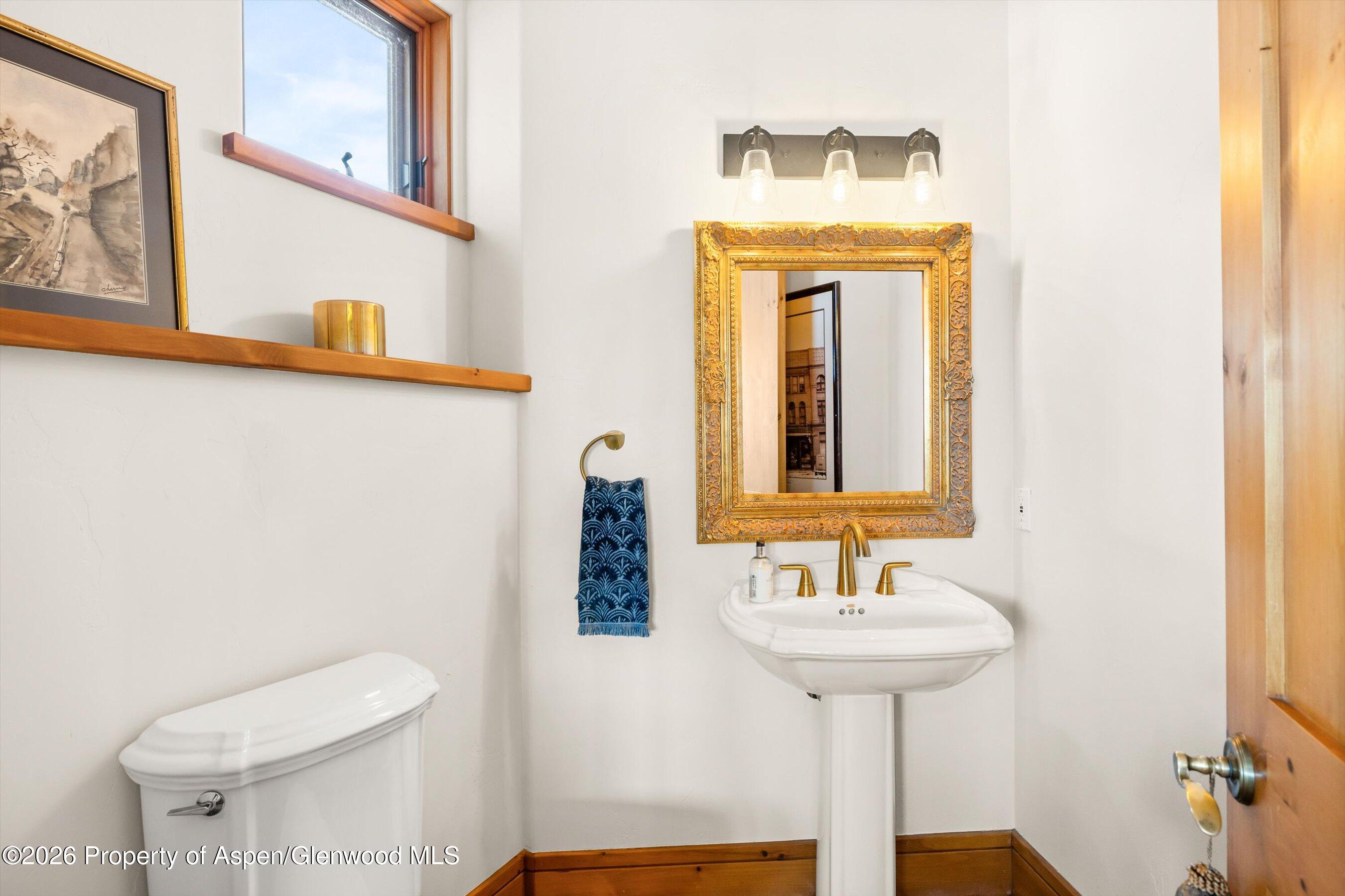 31 Wind River Road Carbondale, CO 81623 - Photo 39 of 46 a bathroom with a sink a mirror and a toilet