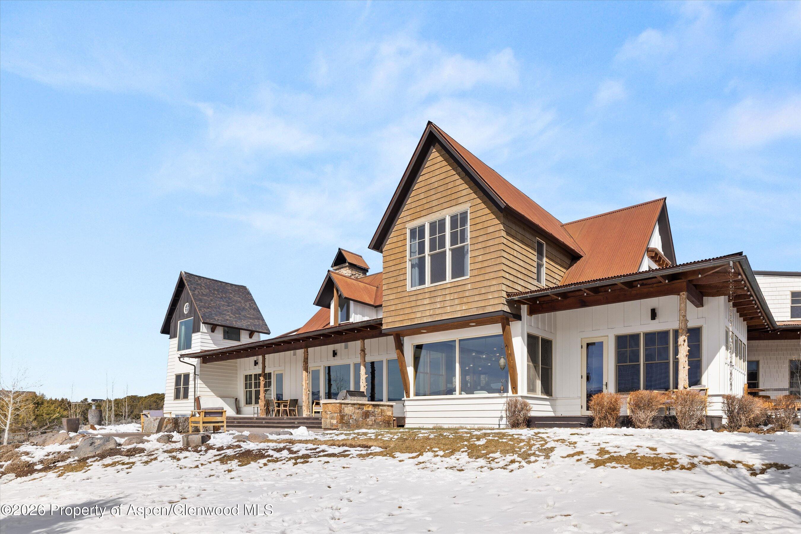 31 Wind River Road Carbondale, CO 81623 - Photo 43 of 46 a front view of a house with a snow in the background