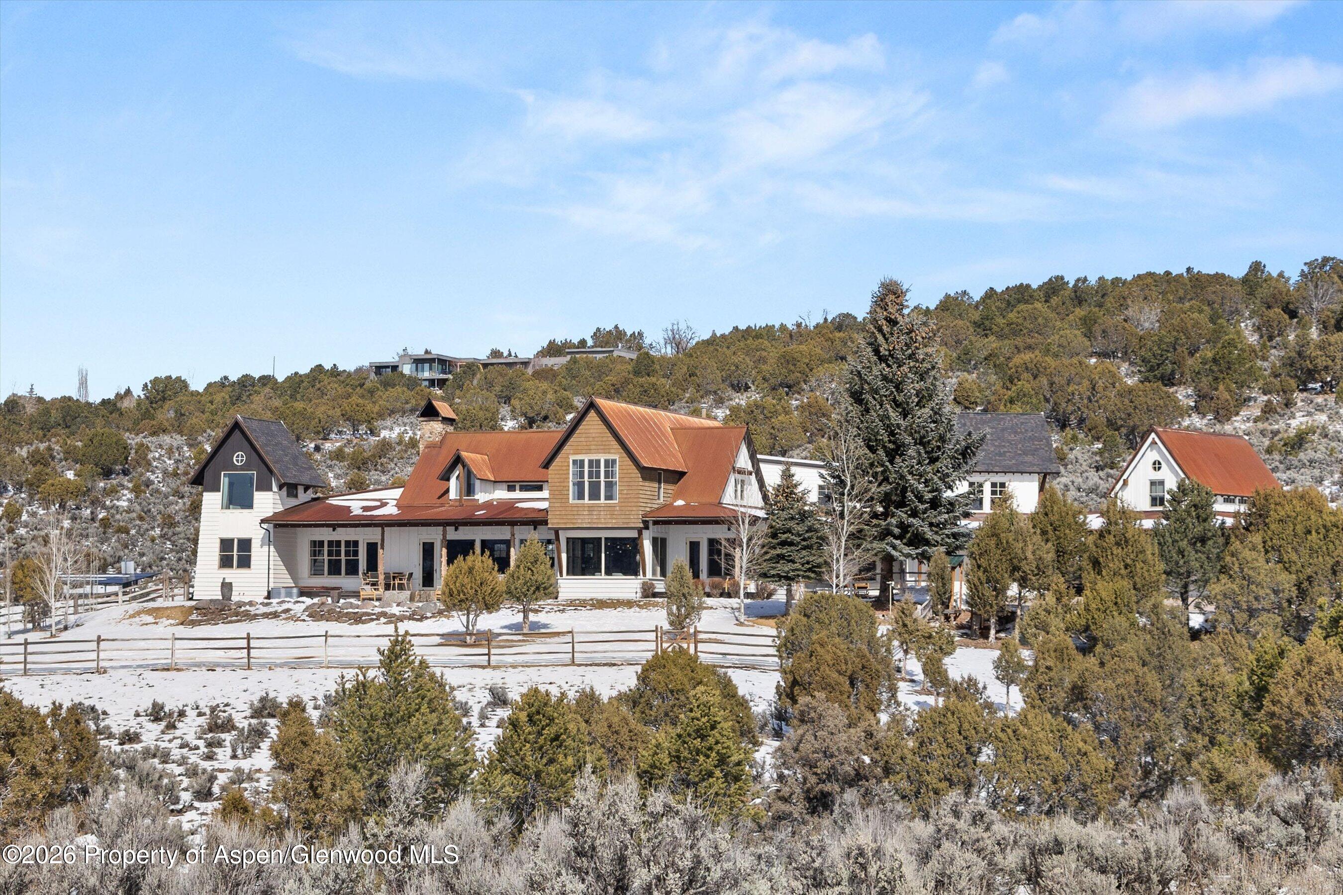 31 Wind River Road Carbondale, CO 81623 - Photo 45 of 46 a front view of a house with a yard basket ball court and outdoor seating