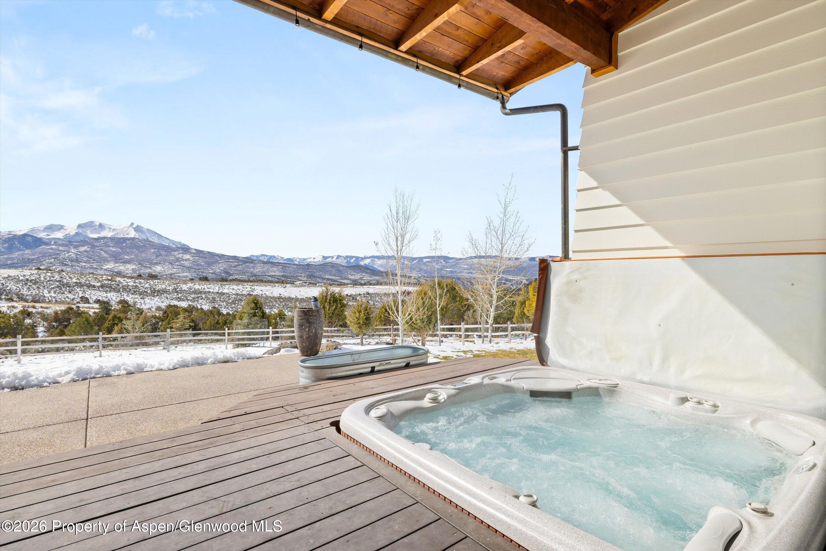 31 Wind River Road Carbondale, CO 81623 - Photo 7 of 46 a view of a terrace with wooden floor and lake view