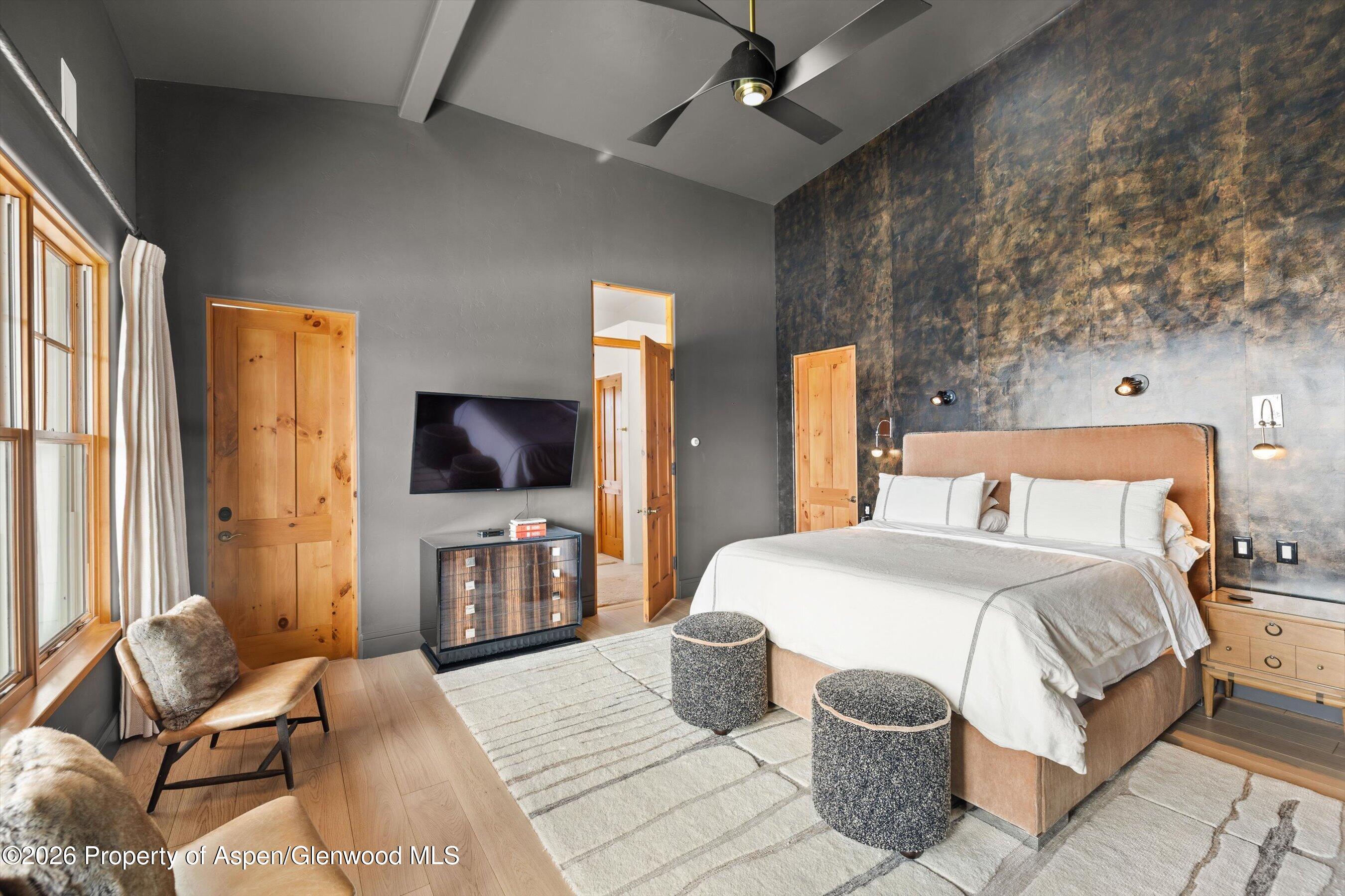 31 Wind River Road Carbondale, CO 81623 - Photo 8 of 46 a bedroom with a bed and a television