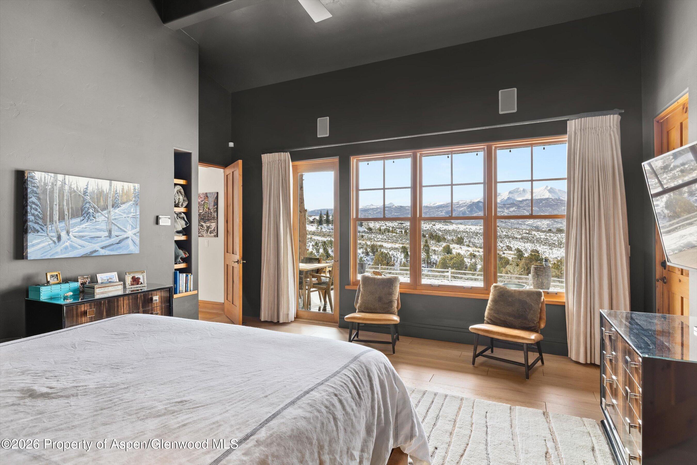 31 Wind River Road Carbondale, CO 81623 - Photo 9 of 46 a bedroom with a large bed and a large window