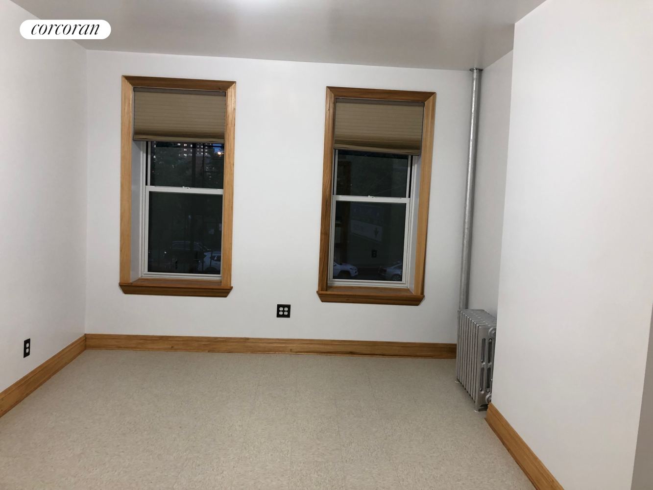 a view of an empty room with a window
