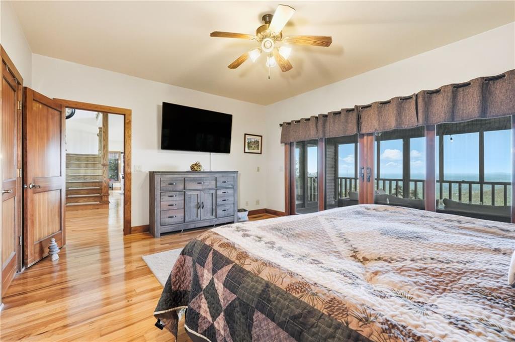 49 Rimrock Road Jasper, GA 30143 - Photo 24 of 61 a spacious bedroom with a bed and a flat screen tv