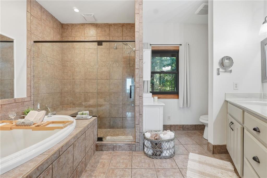 49 Rimrock Road Jasper, GA 30143 - Photo 25 of 61 a bathroom with a sink toilet and shower
