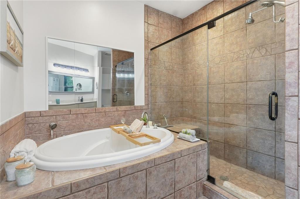 49 Rimrock Road Jasper, GA 30143 - Photo 26 of 61 a bathroom with a sink a toilet and shower