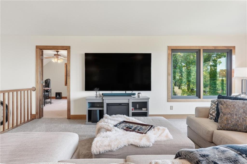 49 Rimrock Road Jasper, GA 30143 - Photo 32 of 61 a living room with furniture and a flat screen tv
