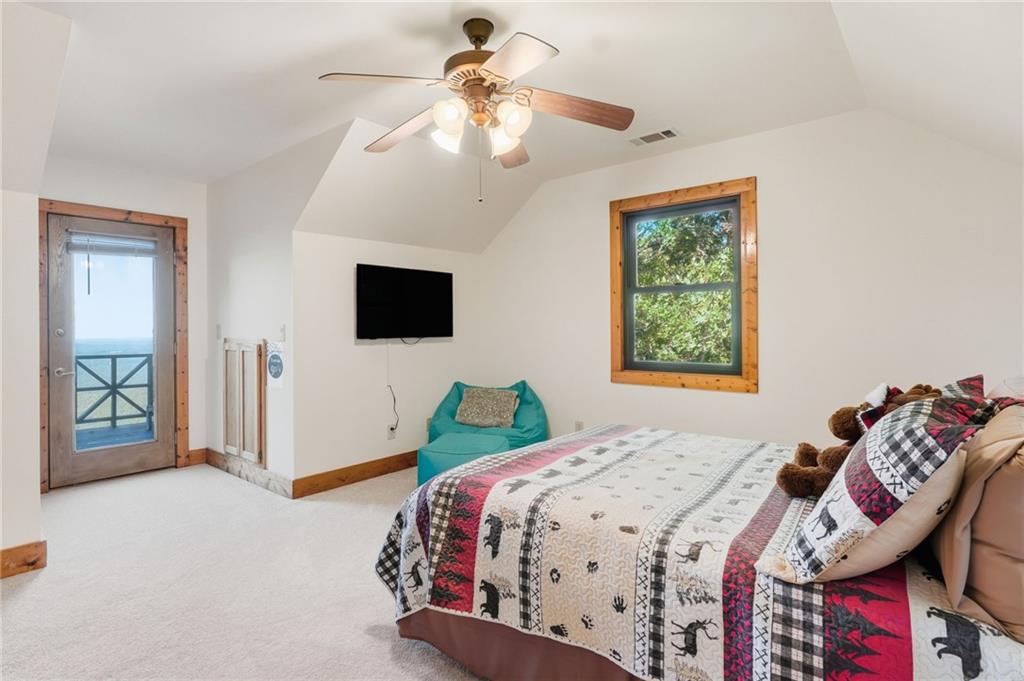 49 Rimrock Road Jasper, GA 30143 - Photo 35 of 61 a bedroom with a bed and a flat screen tv